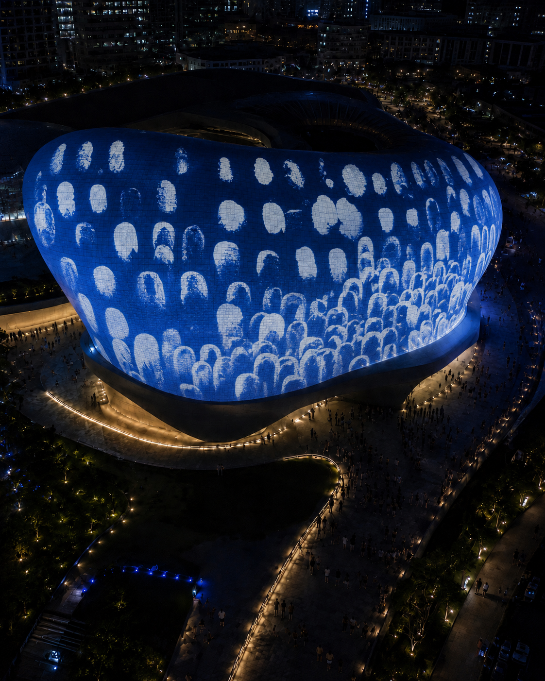 Aerial night view of white Dearly flower imprints covering DDP Seoul in blue light
