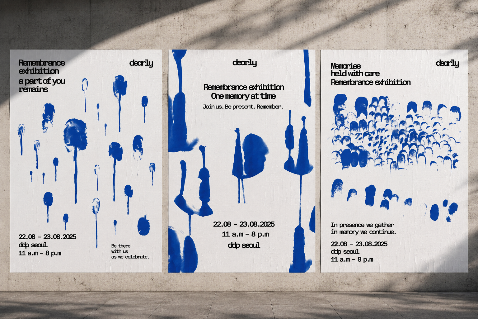 Three large Dearly remembrance posters installed separately on a concrete wall