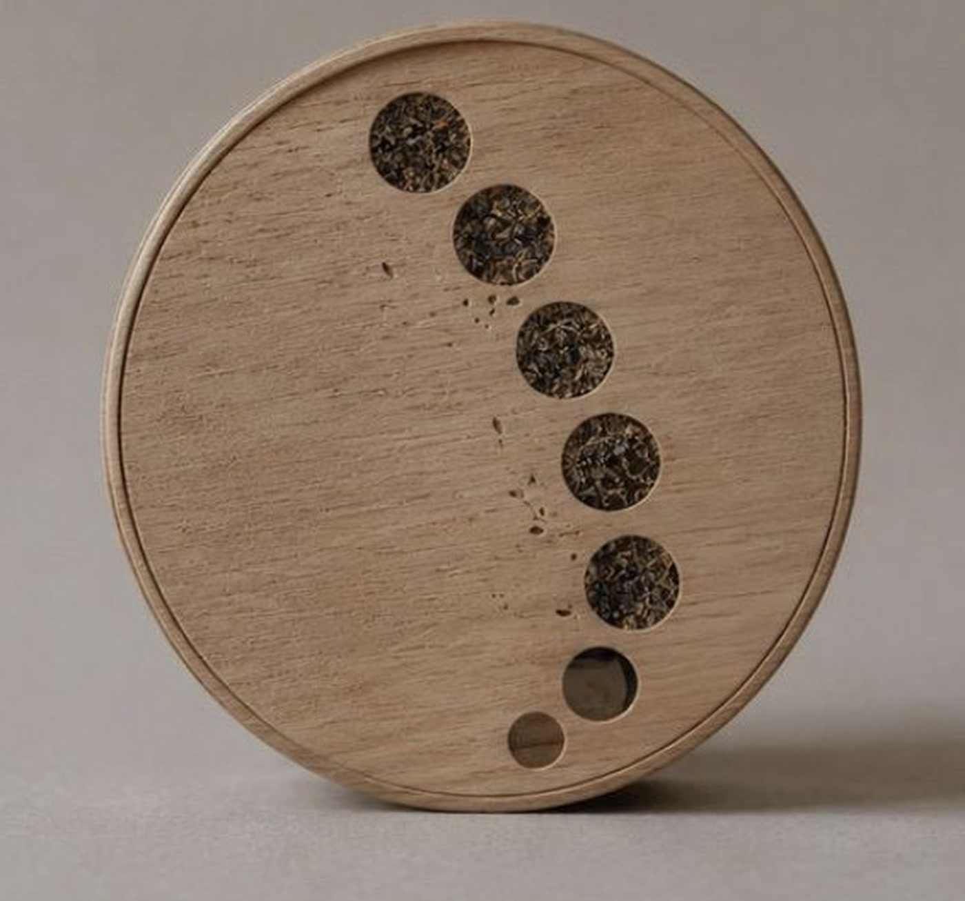 Back of the Mikazuki tea box with moon-shaped openings