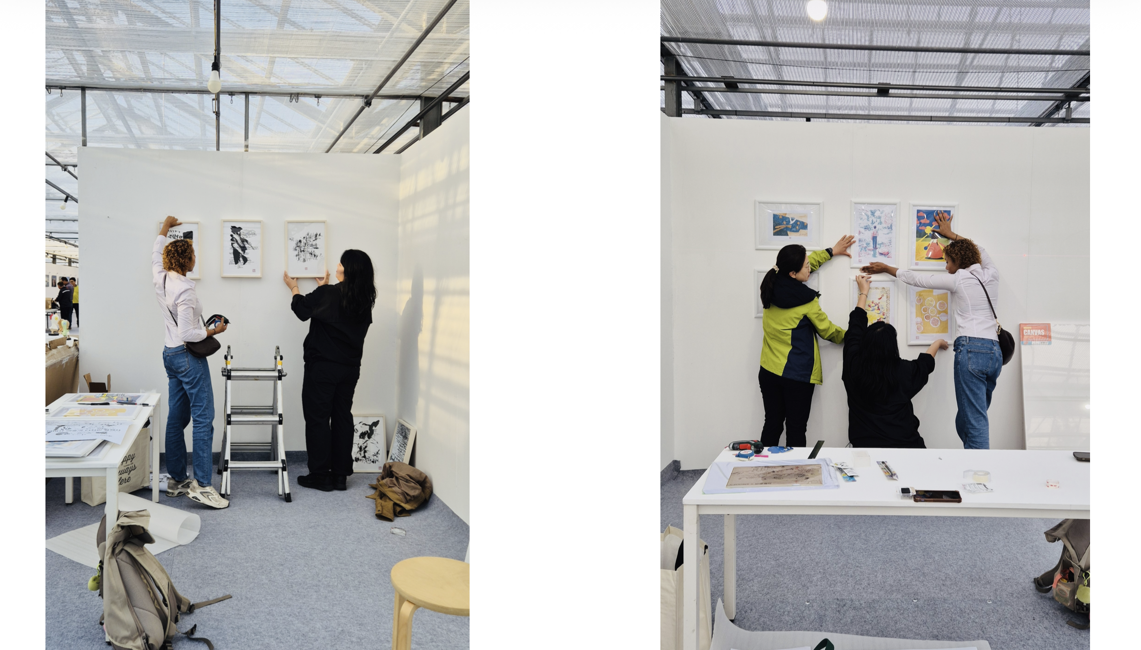 Installing framed works at the Geoje exhibition