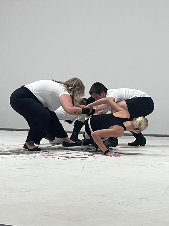 A clustered group gesture during the performance