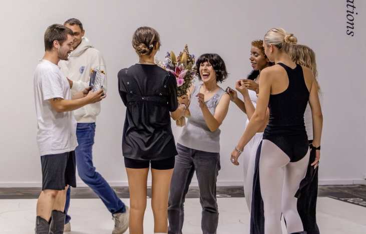 Performers and collaborators gathering after NET 5